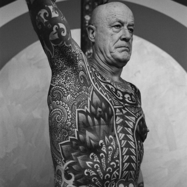 Complex blackwork tattoo by Thomas Hooper, featuring intricate geometric patterns and layered textures. Known for his abstract, meditative style, Thomas creates tattoos that blend organic and cosmic forms with precise linework and deep visual rhythm.