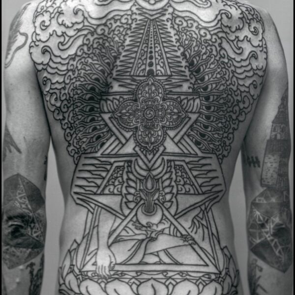 Complex blackwork tattoo by Thomas Hooper, featuring intricate geometric patterns and layered textures. Known for his abstract, meditative style, Thomas creates tattoos that blend organic and cosmic forms with precise linework and deep visual rhythm.