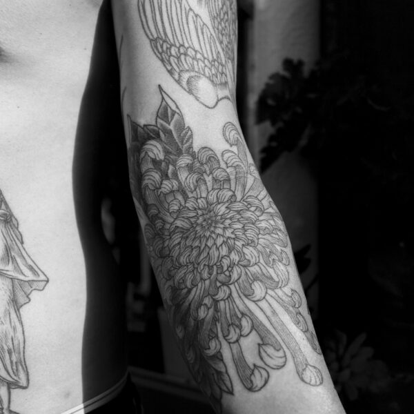 Complex blackwork tattoo by Thomas Hooper, featuring intricate geometric patterns and layered textures. Known for his abstract, meditative style, Thomas creates tattoos that blend organic and cosmic forms with precise linework and deep visual rhythm.