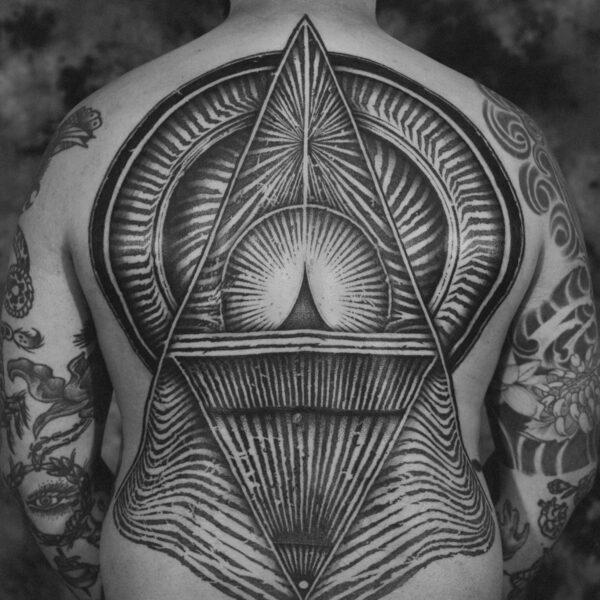 Complex blackwork tattoo by Thomas Hooper, featuring intricate geometric patterns and layered textures. Known for his abstract, meditative style, Thomas creates tattoos that blend organic and cosmic forms with precise linework and deep visual rhythm.