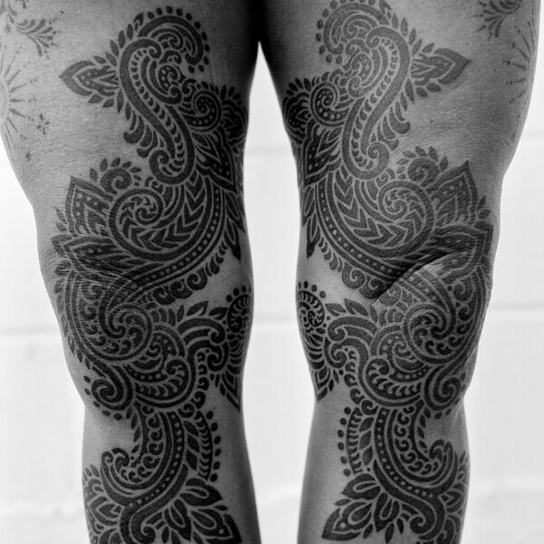 Complex blackwork tattoo by Thomas Hooper, featuring intricate geometric patterns and layered textures. Known for his abstract, meditative style, Thomas creates tattoos that blend organic and cosmic forms with precise linework and deep visual rhythm.