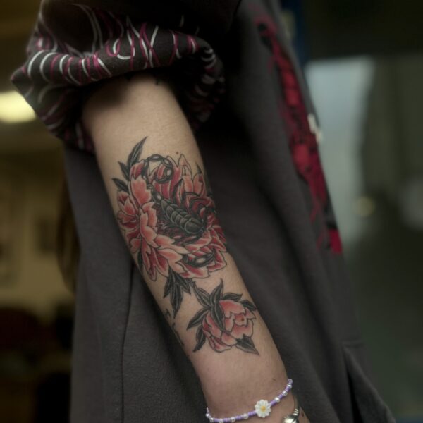 Healed and Settled Black and Red Scorpion and Peony tattooed in Fineline Style by Harriet Street at Nowhere Tattooing in Brighton UK