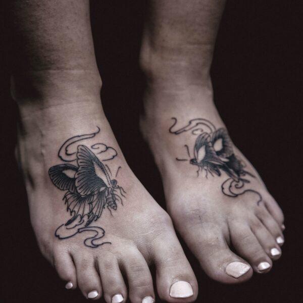 Soft and feminine fine line butterfly tattoos