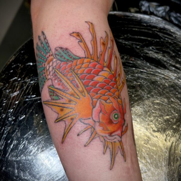 Traditional Japanese take on a Lionfish, in bright colours and fine lines. Tattooed by Harriet Street in Brighton.