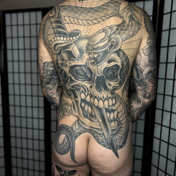 Full, bold, black and grey back piece, drawn freehand on the skin and tattooed by Antony Dickinson in Brighton, East Sussex UK