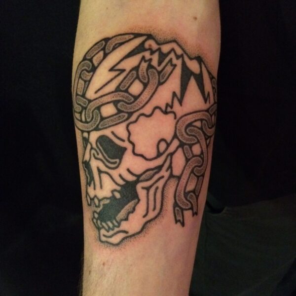 Hand-poked tattoo by Adam Sage, featuring smooth, precise linework and strong graphic composition. Inspired by brutalist architecture, children’s book illustration, and Soviet poster design, Adam creates timeless, non-electric tattoos with bold, simple forms.