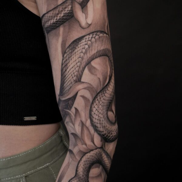 Detailed tattoo by Alex Rufio showcasing clean lines and strong composition, blending illustrative and realistic styles. Inspired by European Renaissance and postwar artists, Alex’s work balances classic influences with modern execution, creating timeless custom pieces.