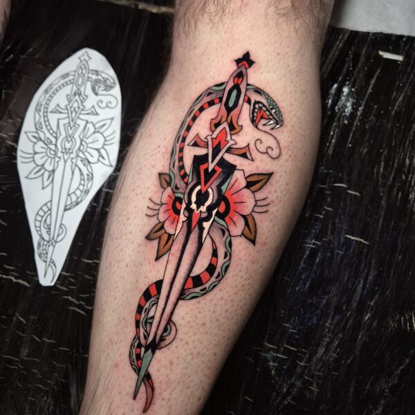 European Trad style Snake & Dagger Tattoo by Edoardo Cucchelli. Edoardo is based at Nowhere Tattoo Shop in Brighton, UK. With over a decades experience tattooing, Edo has the ability to create tattoo pieces in all styles, from traditional, and finaline, to script and realism.