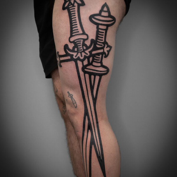 A bold large-scale rendition of two longswords by Mouse. Mouse is resident artist at Nowhere Tattoo Shop in Brighton, who focuses on creating whimsical, fantasy based tattoos.