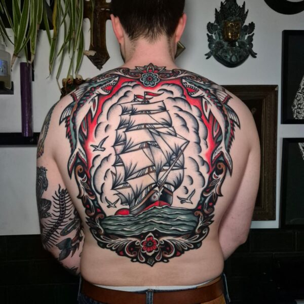 Traditional style back piece tattoo of a sailing ship by Edoardo Cucchelli. Edoardo is a specialist in Euro-Traditional Tattooing, and is always interested in hearing from new clients about their ideas or projects.