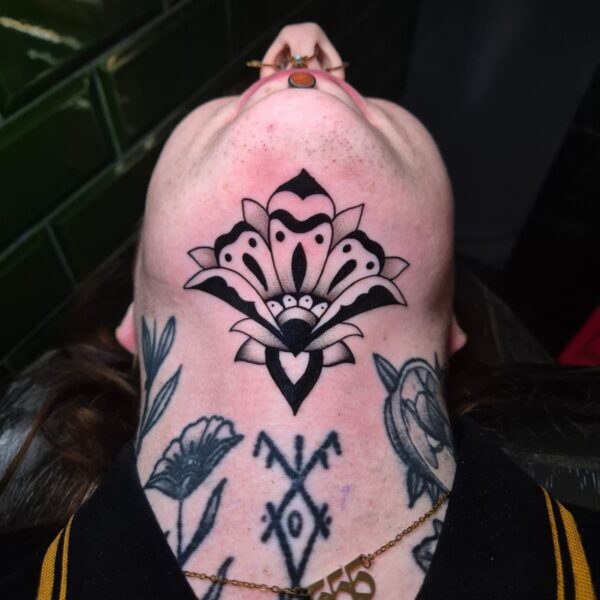 Detailed Victorian Ornamental neck tattoo, placed under the chin. This work was done by resident artist Edoardo Cucchelli and is a shining example to his ability of creating clean, intricate tattoo's.