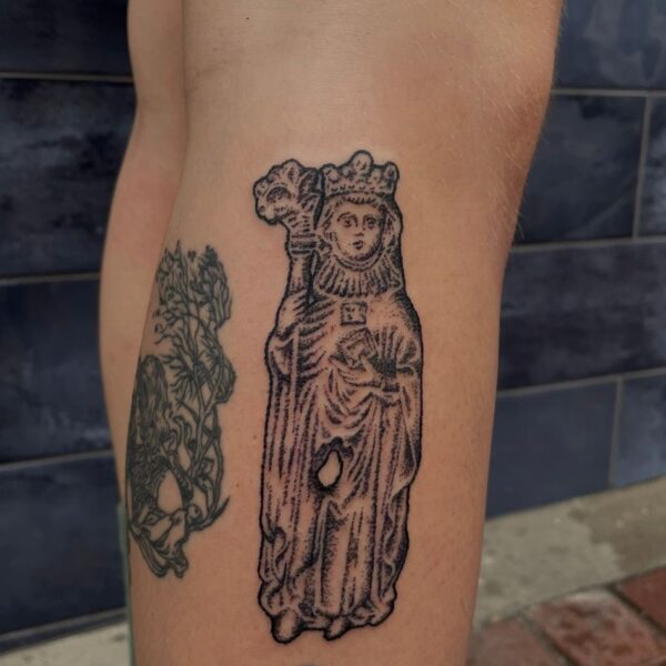 Handpoke tattoo by Rhianna I’Anson, featuring detailed, textural linework inspired by artefacts, stonework, and folklore. Rhianna works from Nowhere Tattooing in Brighton, blending traditional techniques with a timeless, organic style