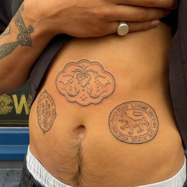 Handpoke tattoo by Rhianna I’Anson, featuring detailed, textural linework inspired by artefacts, stonework, and folklore. Rhianna works from Nowhere Tattooing in Brighton, blending traditional techniques with a timeless, organic style