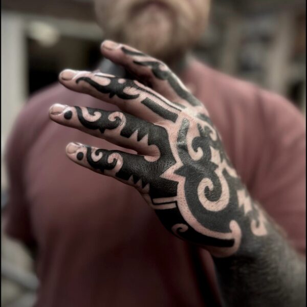 Bold blackwork tattoo by Francesco Capro, featuring strong ornamental patterns and timeless design. Francesco, originally from Northern Italy, works from Nowhere Tattooing in Brighton and Seven Doors Tattoo in London, bringing over thirteen years of experience and a passion for powerful, culturally rich tattoo art.