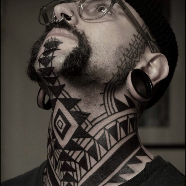 Bold blackwork tattoo by Francesco Capro, featuring strong ornamental patterns and timeless design. Francesco, originally from Northern Italy, works from Nowhere Tattooing in Brighton and Seven Doors Tattoo in London, bringing over thirteen years of experience and a passion for powerful, culturally rich tattoo art.