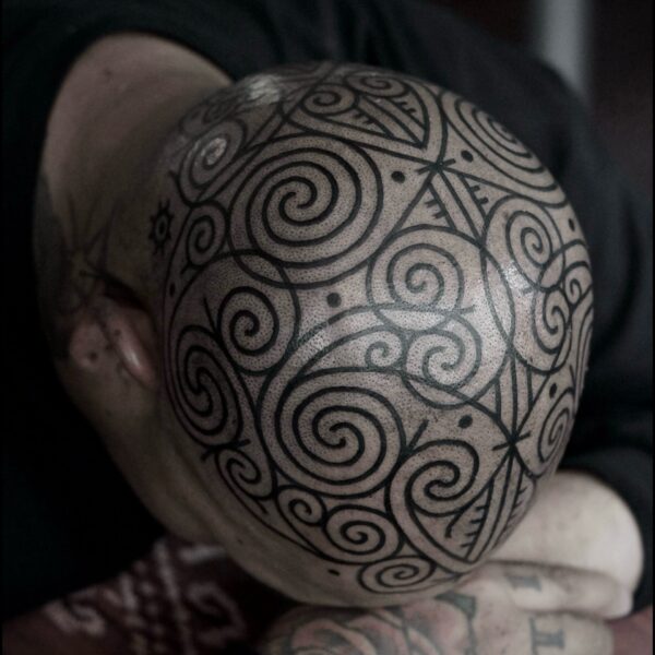 Bold blackwork tattoo by Francesco Capro, featuring strong ornamental patterns and timeless design. Francesco, originally from Northern Italy, works from Nowhere Tattooing in Brighton and Seven Doors Tattoo in London, bringing over thirteen years of experience and a passion for powerful, culturally rich tattoo art.