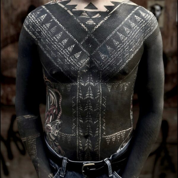 Bold blackwork tattoo by Francesco Capro, featuring strong ornamental patterns and timeless design. Francesco, originally from Northern Italy, works from Nowhere Tattooing in Brighton and Seven Doors Tattoo in London, bringing over thirteen years of experience and a passion for powerful, culturally rich tattoo art.